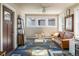 Cozy living room boasts ample natural light, stylish décor, and a comfortable seating area at 3943 Newton St, Denver, CO 80211