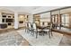 Dining room with modern chandelier, decorative mirror and stone floors at 325 Clayton St, Denver, CO 80206