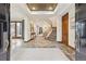 Grand foyer featuring stone floors, high ceilings, and an elegant staircase at 325 Clayton St, Denver, CO 80206