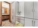 Hallway with stone tile flooring and custom built in storage at 325 Clayton St, Denver, CO 80206