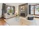 Cozy living room featuring a stylish fireplace and comfortable seating at 325 Clayton St, Denver, CO 80206