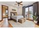 Comfortable bedroom with a balcony and a stylish ensuite bathroom at 325 Clayton St, Denver, CO 80206