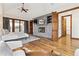 Spacious main bedroom featuring hardwood floors, built-ins, and outside access at 325 Clayton St, Denver, CO 80206