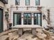 The back patio features an outdoor dining table and fountain at 325 Clayton St, Denver, CO 80206