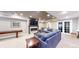 Finished basement with pool table, fireplace, large screen TV and comfortable blue sectional at 3891 W 149Th Ave, Broomfield, CO 80023