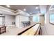 Finished basement with a shuffleboard table, casual seating and bar with barstool seating at 3891 W 149Th Ave, Broomfield, CO 80023