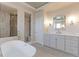 A bright, updated bathroom with a soaking tub, walk-in shower, and dual sink vanity at 3891 W 149Th Ave, Broomfield, CO 80023