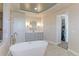 A bright, updated bathroom with a soaking tub, walk-in shower, and dual sink vanity at 3891 W 149Th Ave, Broomfield, CO 80023