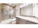 Modern bathroom featuring a glass shower with tile surround, vanity, and neutral color palette at 3891 W 149Th Ave, Broomfield, CO 80023