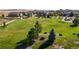 Aerial view of a community featuring a large grassy area, walking path, and beautiful homes at 3891 W 149Th Ave, Broomfield, CO 80023