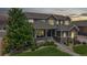 Charming two-story home featuring inviting front porch and well-maintained landscaping at dusk at 3891 W 149Th Ave, Broomfield, CO 80023