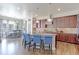 Spacious kitchen with island seating, pendant lighting, and breakfast nook with large windows at 3891 W 149Th Ave, Broomfield, CO 80023