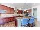 Well-equipped kitchen with granite countertops, stainless steel appliances, and breakfast bar seating at 3891 W 149Th Ave, Broomfield, CO 80023