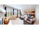 Comfortable living room with ample seating, fireplace, and view of the backyard at 3891 W 149Th Ave, Broomfield, CO 80023