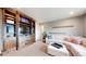 Cozy living room with built-in shelving, plush seating, and lots of natural light at 3891 W 149Th Ave, Broomfield, CO 80023