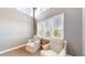 Bright living room space featuring high ceilings, neutral colors, and light-filled windows with wooded views at 3891 W 149Th Ave, Broomfield, CO 80023