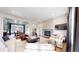 Spacious living room with fireplace, plush seating, and open floor plan to dining area at 3891 W 149Th Ave, Broomfield, CO 80023