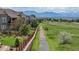 View of residential neighborhood and path with mountain backdrop in distance at 3891 W 149Th Ave, Broomfield, CO 80023