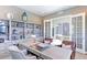 Comfortable office with large wooden desk, built in bookshelves, and a sliding door leading to an outside patio at 3891 W 149Th Ave, Broomfield, CO 80023