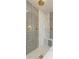 Detailed view of a modern, tiled walk-in shower with dual shower heads and a built-in bench at 3891 W 149Th Ave, Broomfield, CO 80023