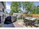 Enjoy outdoor living on this back deck featuring a dining set and grill, perfect for entertaining Gathering and friends at 13695 W 67Th Cir, Arvada, CO 80004