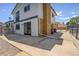Paved backyard area features a brick chimney and mature trees, perfect for outdoor activities and relaxation at 13695 W 67Th Cir, Arvada, CO 80004