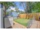 Backyard featuring a putting green, shed, and secure fencing, providing both recreation and privacy at 13695 W 67Th Cir, Arvada, CO 80004