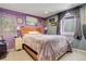 Cozy bedroom with double bed, and creative lighting to the wall art at 13695 W 67Th Cir, Arvada, CO 80004