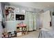 Cozy bedroom with ample storage and closet space, with TV and eclectic decor at 13695 W 67Th Cir, Arvada, CO 80004