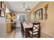 Comfortable dining room with bar seating and natural light at 13695 W 67Th Cir, Arvada, CO 80004