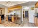 Modern kitchen featuring stainless steel appliances, sleek countertops, and hardwood floors at 13695 W 67Th Cir, Arvada, CO 80004