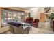 Bright living room with a large window, comfortable seating and staircase at 13695 W 67Th Cir, Arvada, CO 80004