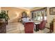 Cozy living room with a large window, comfortable seating, and hardwood floors at 13695 W 67Th Cir, Arvada, CO 80004