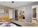 Large bedroom features a walk in closet, neutral color scheme, ceiling fan and great lighting at 13695 W 67Th Cir, Arvada, CO 80004
