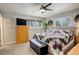 Inviting bedroom with neutral color scheme, ceiling fan and great lighting at 13695 W 67Th Cir, Arvada, CO 80004