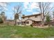 Expansive backyard with a brick patio is perfect for entertaining and enjoying outdoor living at 2410 S Lima St, Aurora, CO 80014