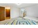 Bright bedroom with neutral carpet, ample natural light, and a closet for storage at 2410 S Lima St, Aurora, CO 80014