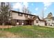 Traditional two-story home with a well-manicured lawn and attached garage at 2410 S Lima St, Aurora, CO 80014