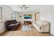 Inviting living room with comfortable seating, ceiling fan, and modern decor at 2410 S Lima St, Aurora, CO 80014