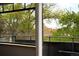 Balcony view showcasing the surrounding trees and city rooftops at 636 N Washington St # 301, Denver, CO 80203