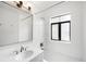 Bright bathroom featuring subway tile, tub, shower, and ample natural light at 636 N Washington St # 301, Denver, CO 80203