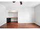 Bright bedroom featuring built-in desk with black cabinet and rich-toned hardwood floors at 636 N Washington St # 301, Denver, CO 80203