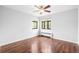 Bedroom with hardwood floors, ceiling fan, and large windows at 636 N Washington St # 301, Denver, CO 80203