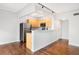 Modern kitchen featuring stainless steel appliances, white countertops, and light wood cabinets at 636 N Washington St # 301, Denver, CO 80203