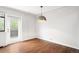 Bright living room featuring hardwood floors and balcony access at 636 N Washington St # 301, Denver, CO 80203