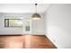 Bright living room featuring hardwood floors, large window, and balcony access at 636 N Washington St # 301, Denver, CO 80203