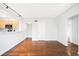 Open-concept space with hardwood flooring, and a partial view into the adjoining kitchen at 636 N Washington St # 301, Denver, CO 80203
