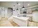 Modern kitchen with gray cabinets, quartz countertops, and stainless steel appliances at 8508 Silverton Ln, Littleton, CO 80125