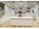 Modern kitchen with gray cabinets, quartz countertops, and stainless steel appliances at 8508 Silverton Ln, Littleton, CO 80125