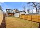 Backyard view of house with a garage and a balcony over the folding glass wall at 2056 S Ogden St, Denver, CO 80210